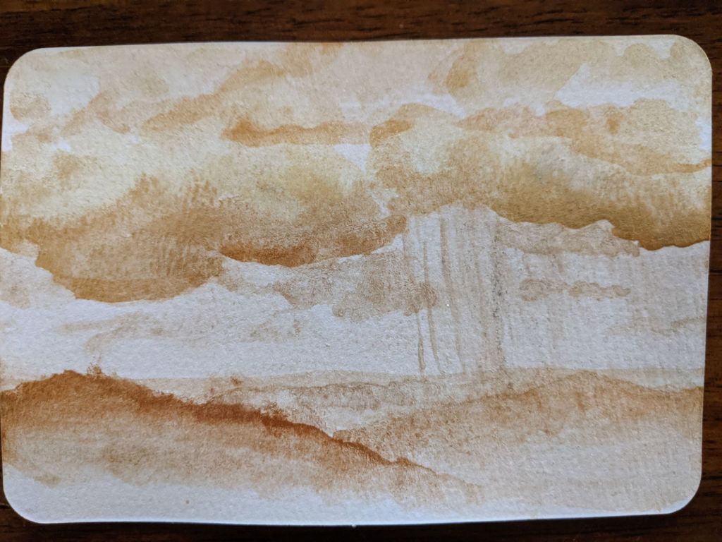 Golden ticket art postcard depicting rain from storm clouds onto hills