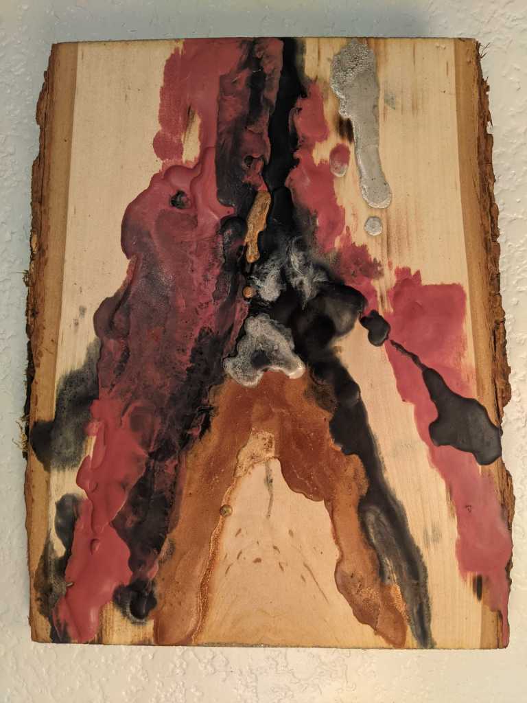 abstract art: encaustic on tree slice